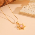 Detail of golden sun pendant with pink opal stone and zircons on snake chain - Pink Zirconia Necklace / Gold