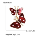 Broche papillon en alliage avec émail rouge et perles, dimensions 3,3cm sur 3,1cm - Rouge