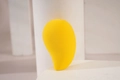 Yellow gourd-shaped makeup sponge for dual wet and dry use on white geometric base - Yellow Gourd
