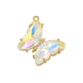 Detail of a gold butterfly pendant with iridescent wings and sparkling crystals - White