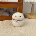 Detailed view of a hand-carved style cat figurine with red collar and golden bell - Tuxedo Cat (Large)