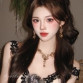 Elegant gold waterdrop necklace and earrings set worn by model on black lace top - 4# Champagne Water Drop Necklace Earring Set (HN5047-4)