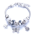 Silver snake chain bracelet with Princess crown pendant and Love beads in a variant style - White