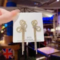Sparkling gold-tone S925 silver needle bow earrings with long rhinestone tassels - Gold Light Luxury Bow Full Rhinestone Long Tassel Earrings (E0146)