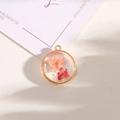 Golden round resin pendant featuring real pink and red dried flowers for DIY jewelry - Style 7