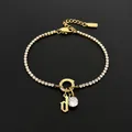 Stainless steel rhinestone bracelet with gold letter 'd' and round crystal pendant - Gold / Letter D