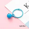 Creative light blue bell keychain with metal ring and clasp on a pink background - Light Blue