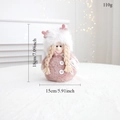Detail of pink Christmas plush doll with retractable legs and knitted texture details - Pink Standing Girl