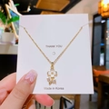 Collana minimalista placcata in oro con ciondolo a fiore bianco e zirconi scintillanti - Fiore in Smalto Bianco