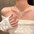Silver double-layer heart pendant necklace and ring set on model in white sweater - 3D Heart Double Layer Chain (X1839) / Silver