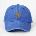 Blue washed cotton baseball cap featuring a yellow sun face embroidery on the front - Royal Blue