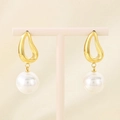 Detail of gold teardrop pearl earrings displayed on an elegant cream jewelry stand - Gold Waterdrop (KE115797-GC)