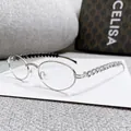 Occhiali ovali argento con decorazioni in cristallo a cuore sulle aste metalliche - Montatura Argento Lente Trasparente