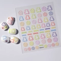 Macro detail of 3D embossed nail stickers featuring colorful bears and floral patterns - Line Bear Style (FEB-814)