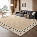 French vintage beige rug with geometric pattern and black border in a modern living room - Persian Velvet - Misty Moon Corridor