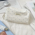 Detail of striped heart makeup bag with textured cotton fabric and woven brand label - Blue (Large)