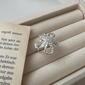 Elegant S925 silver flower ring with zircon inlay set in a minimalist jewelry box - 925 Silver / Hollow Flower Ring(JZF029)