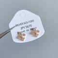 Rose gold fleur-de-lis earrings in 925 silver presented on a Japanese product card - Fleur-de-lis Stud Earrings Rose Gold