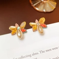 Boucles d'oreilles papillon faites main avec perles jaunes et cristaux sur livre - Boucles d'oreilles papillon en perles colorées faites à la main