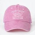 Detail shot of the VINTAGE 1973 print on washed pink cotton canvas baseball cap - One Size / Pink