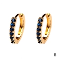 Close-up of 18K gold plated hoop earrings with seven inlaid dark blue zircon stones - Dark Blue