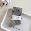 Grey cotton mid-calf socks with black polka dots and white paper brand packaging - One Size / Light Gray