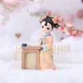Traditional Chinese girl figurine reading book in yellow and blue hanfu attire - Chess Playing Maiden Figurine