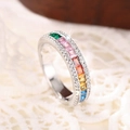 Detailed macro view of silver ring with rainbow zircon stones and white diamond accents - US 6 / White Gold