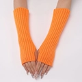 Close-up of bright orange ribbed knit arm warmers with a stylish fingerless design - Orange