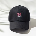 Berretto da baseball nero con ricamo farfalla rosa e testo be the change su panno bianco - Taglia unica / Nero