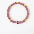 Detailed macro of pink strawberry quartz beaded bracelet with gold accents and cubic zirconia - Pink-Purple Colored Stone Style (WB335)