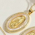 Macro detail of oval Virgin Mary pendant with mother of pearl and zircon stones - Oval Virgin Mary
