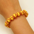 Adjustable woven bracelet with yellow softball beads featuring red stitching on wrist - Beaded Softball Bracelet (WG-1390)