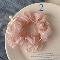Pink floral lace scrunchie with cream ribbon bow detail on white ceramic plate - Tender Pink Lady