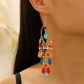 Close-up of bohemian multi-layered long tassel earrings with colorful beads and gold base - KC Gold 12244