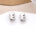 Silver-plated letter E stud earrings with shiny metallic finish on white display - Silver Letter E