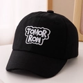 Detailed view of white TOMORROW 3D embroidery on a classic black cotton baseball cap - 52cm (2-5 Years) / Black