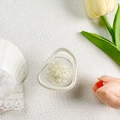 Detailed view of flower-shaped pearl phone grip on a white textured background - Irregular Ring - Pearl Cluster