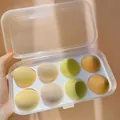 8-piece set of soft makeup sponges in various colors stored in a clear plastic case - Cheese Mango 8-Piece Set