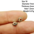 Macro shot of 7mm silver alloy spacer beads for DIY jewelry making held between fingers - 18# (Dia 7mm Thick 2mm)