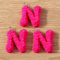 Macro detail of pink rose textured letter N charms with metal rings for DIY jewelry - Letter N / 10 Pieces Pack / Rose Pink