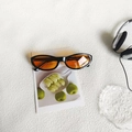 Vintage cat eye sunglasses with glossy black frames and semi-transparent amber lenses - Black Orange