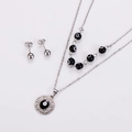 Detailed view of silver evil eye necklace and matching round stud earrings jewelry set - Steel Black