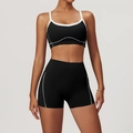 Women's black yoga set with white contrast piping featuring sports bra and high-waisted shorts - XL / Bra + Shorts / Premium Black