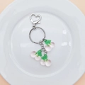 Close-up of translucent pink cherry charms on a silver heart-shaped metal keychain - Pink Cherry (With Keychain)