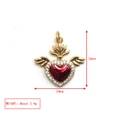 Macro shot of 24mm x 26mm golden winged heart pendant with red stone and clear crystals - Wings Sacred Heart
