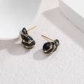 Detail of water drop earrings with black enamel, gold lines and sparkling zircons - Black