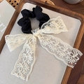 French vintage white lace bow hair scrunchie on a decorative wooden tray with warm lighting - White Lace Bow & Black Scrunchie