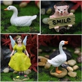 Resin garden miniatures set featuring white geese, a smile hedgehog and a yellow flower fairy - Hedgehog and Duck Set
