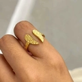 Close-up of golden adjustable open ring with hammered texture worn on finger - Irregular Hammered Style (Gold K651)